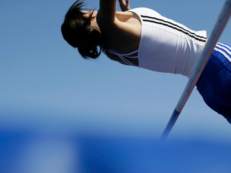 Athlete in mid-motion during a dynamic exercise.